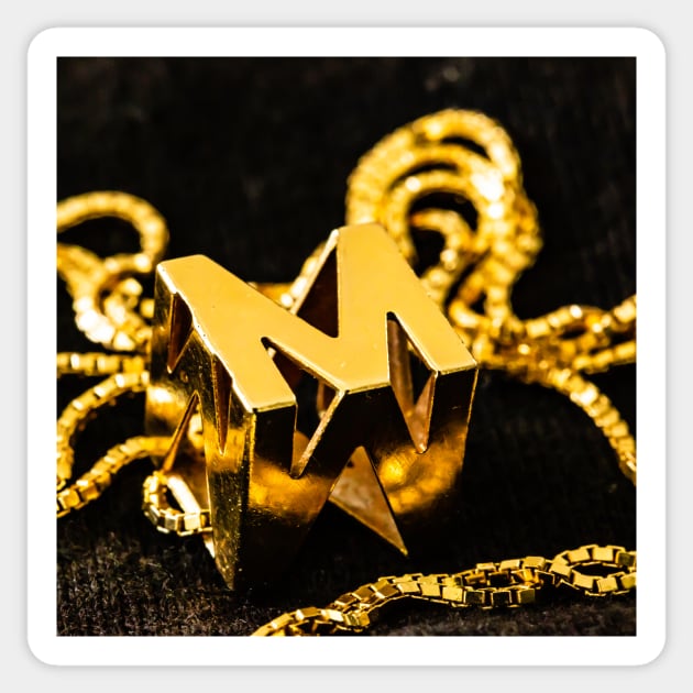 Golden M Sticker by thadz